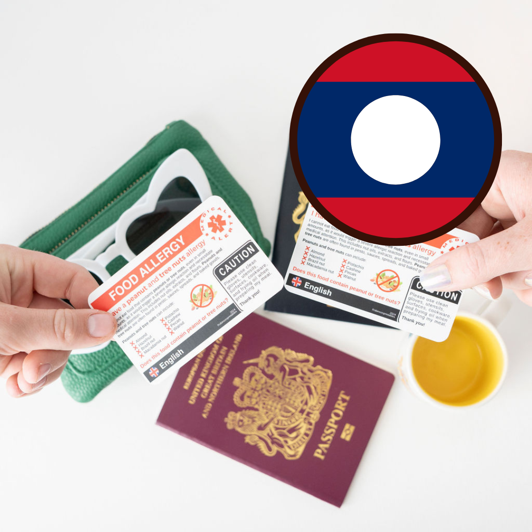 Passport, food allergy card, and wallet on a white background with a magnified Laos flag.