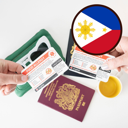 Hands holding food allergy cards with a passport and Philippines flag inset.