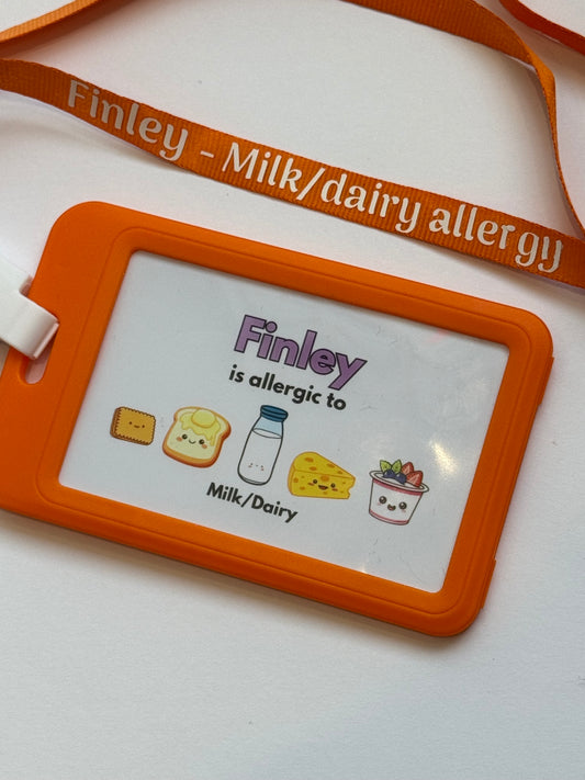 Allergy alert card for milk and dairy with orange border and lanyard on a white background