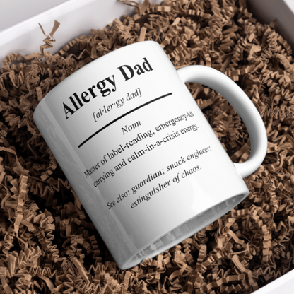 Mug with 'Allergy Dad' definition text on a brown crinkled paper background